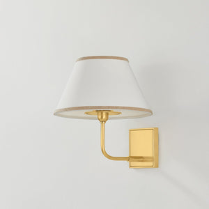 Durland Wall Sconce in aged brass shown from a second angle to highlight the arm curve and shade silhouette.