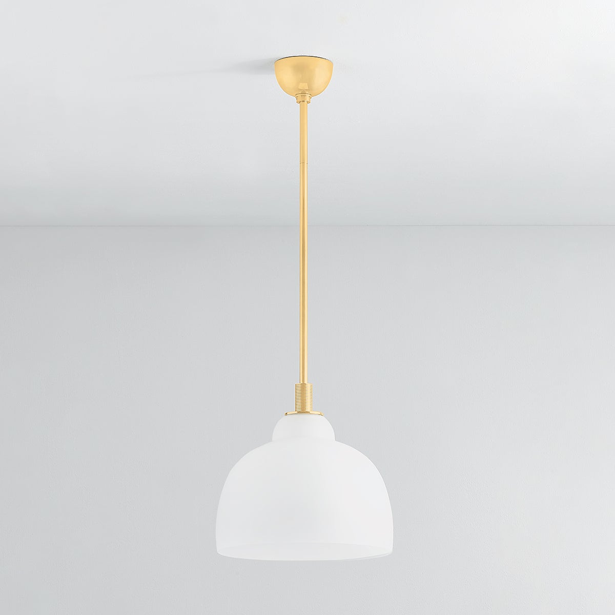 Oberon Pendant 14" in aged brass shown from a second angle to highlight the shade shape and metal detail.