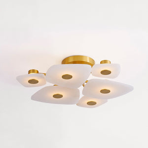Close-up of the Holmdel Semi Flush 27.75" in aged brass showing the shade profile and mounting canopy.