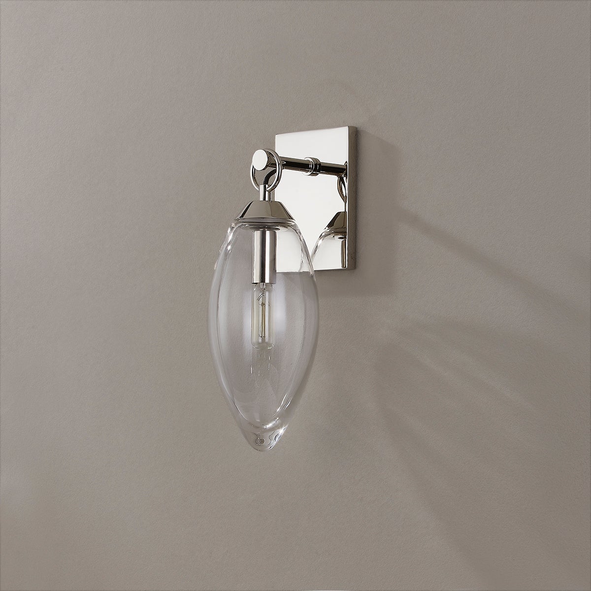 Close-up of the Nantucket Wall Sconce in polished nickel showing the arm curve and shade silhouette.