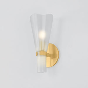 Close-up of the Pine Island Wall Sconce in aged brass showing the arm curve and shade silhouette.