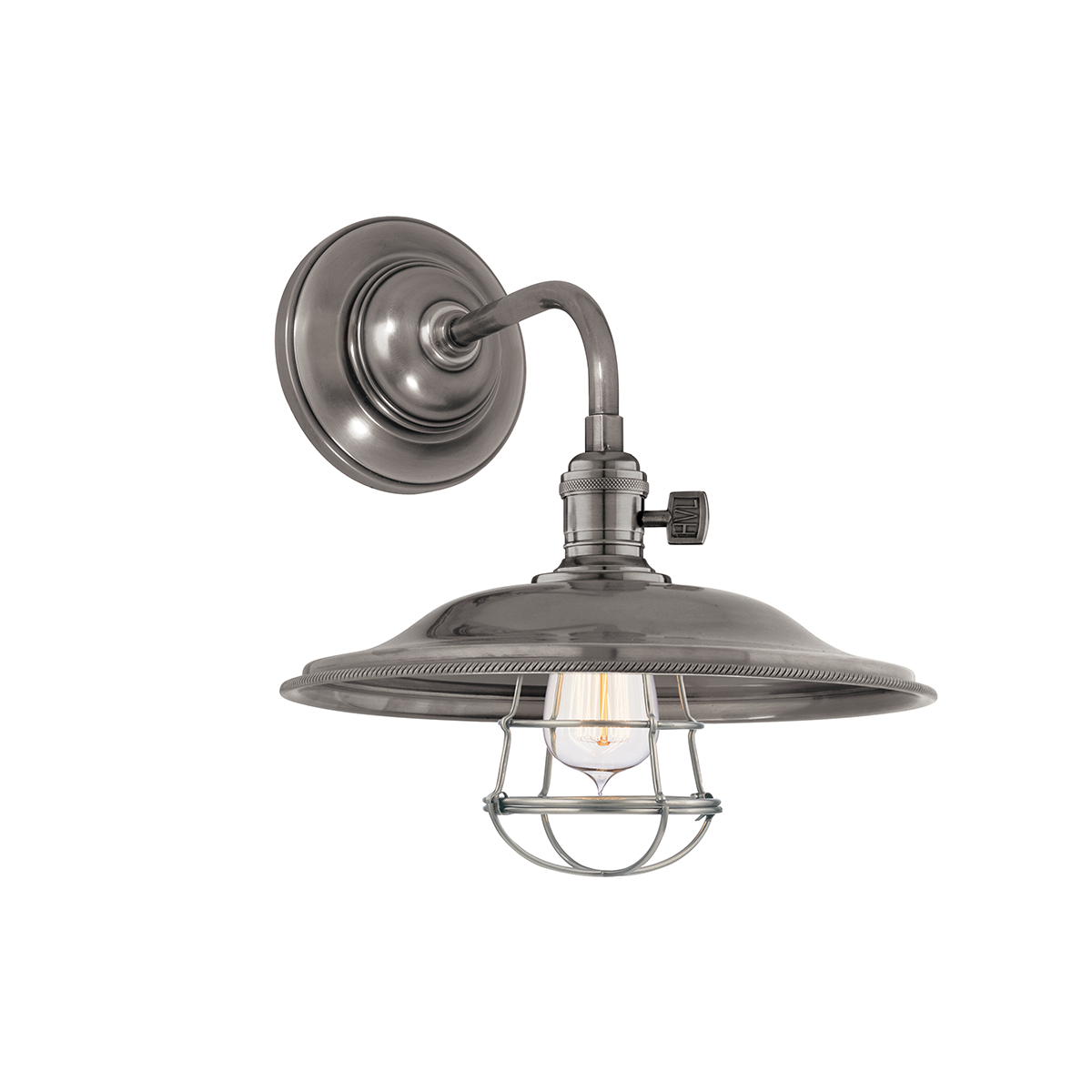 Close-up of the Heirloom Wall Sconce in Aged Brass showing the arm curve and shade silhouette.