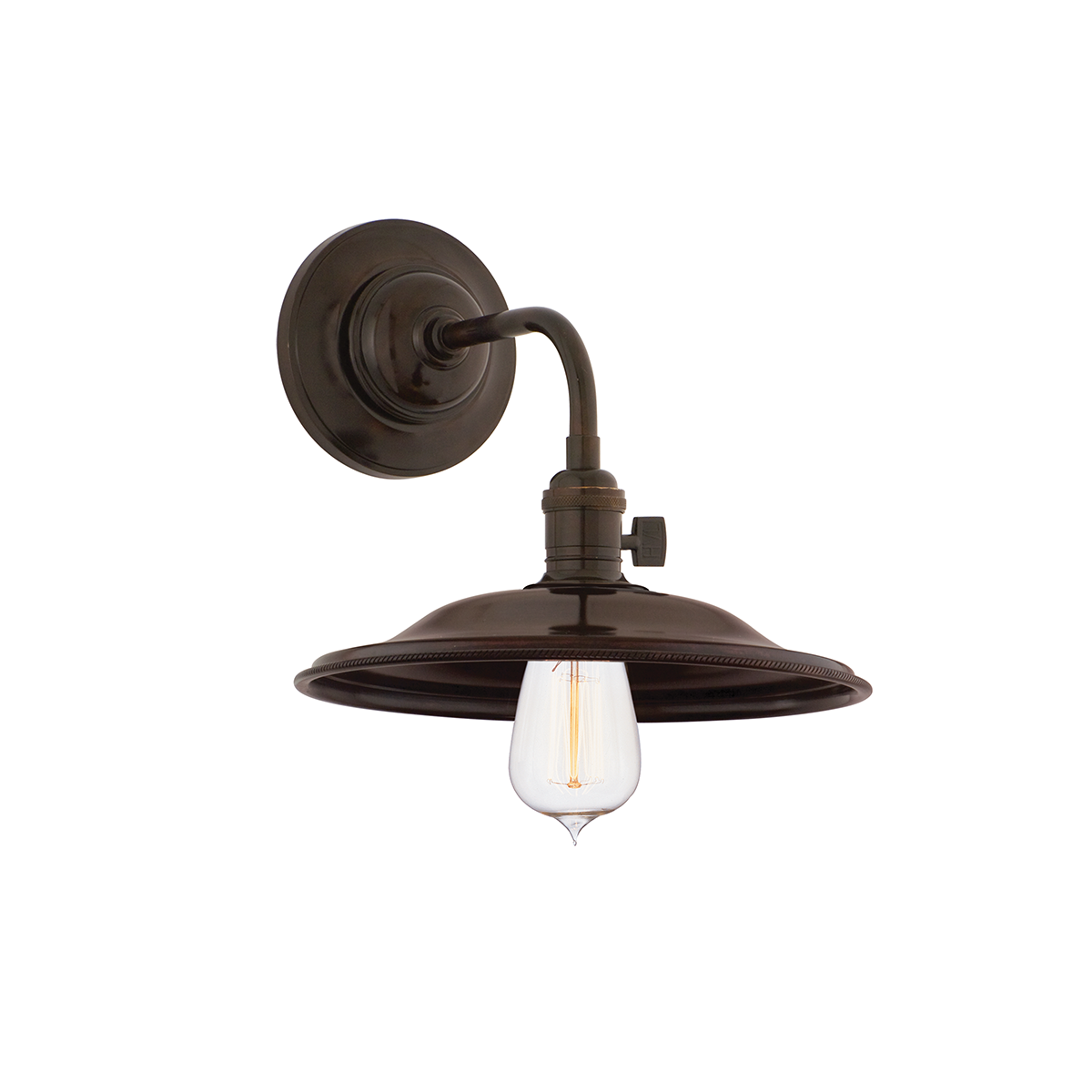 Close-up of the Heirloom Wall Sconce in Aged Brass showing the arm curve and shade silhouette.