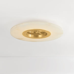Alto Semi Flush in aged brass shown from the front to reveal the shade profile and mounting canopy.