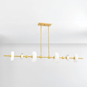 Close-up of the Maynard Linear in aged brass showing the extended frame and shade array.