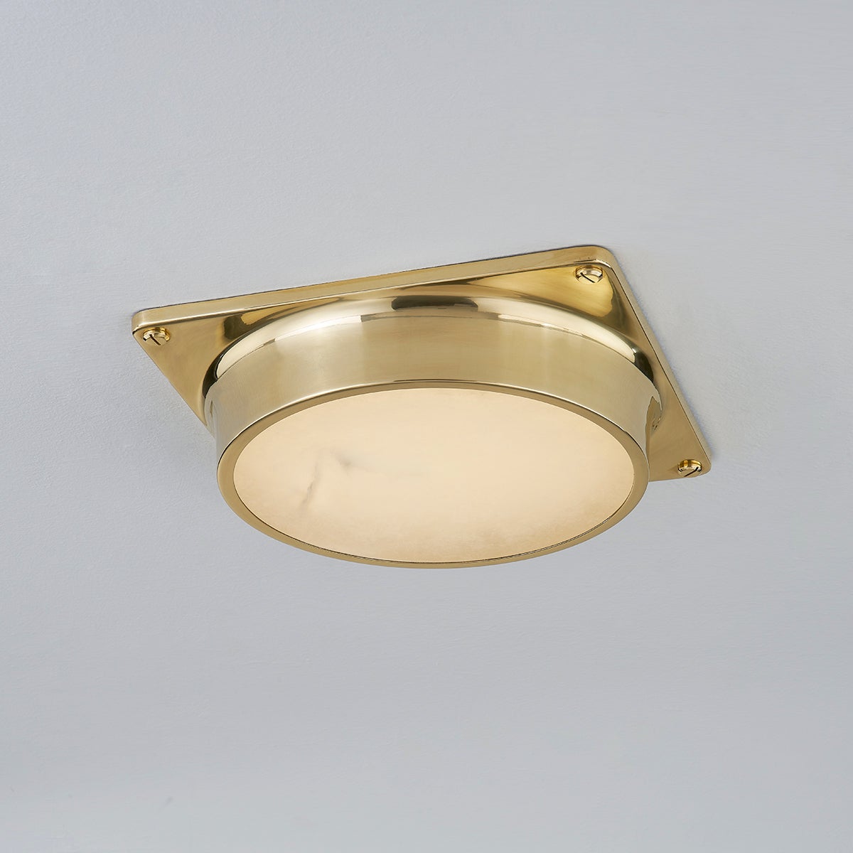 Greenwich Flush Mount in aged brass shown from the front to reveal the shade profile and mounting canopy.