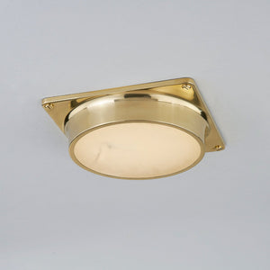 Greenwich Flush Mount in aged brass shown from the front to reveal the shade profile and mounting canopy.