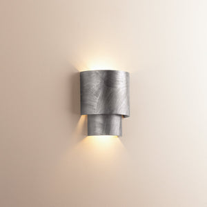 Close-up of the Moray Wall Sconce in Black Silver Leaf showing the arm curve and shade silhouette.