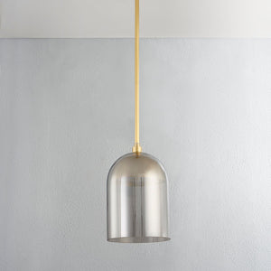 Dorval Pendant 9" in aged brass shown from a second angle to highlight the shade shape and metal detail.