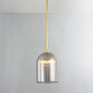 Dorval Pendant 9" in aged brass shown from the front to reveal the shade shape and metal detail.