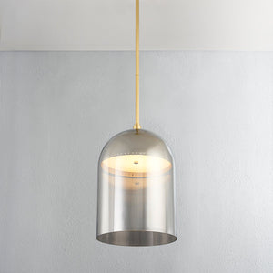 Close-up of the Dorval Pendant 13" in aged brass showing the shade shape and metal detail.