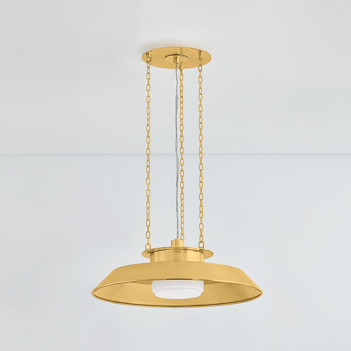 Woodrow Pendant 22" in aged brass shown from the front to reveal the shade shape and metal detail.