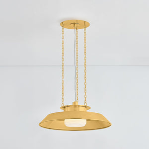 Close-up of the Woodrow Pendant 22" in aged brass showing the shade shape and metal detail.
