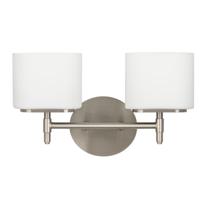 Trinity Bath And Vanity 13.75" in satin nickel shown from a second angle to highlight the arm spread and shade silhouette.
