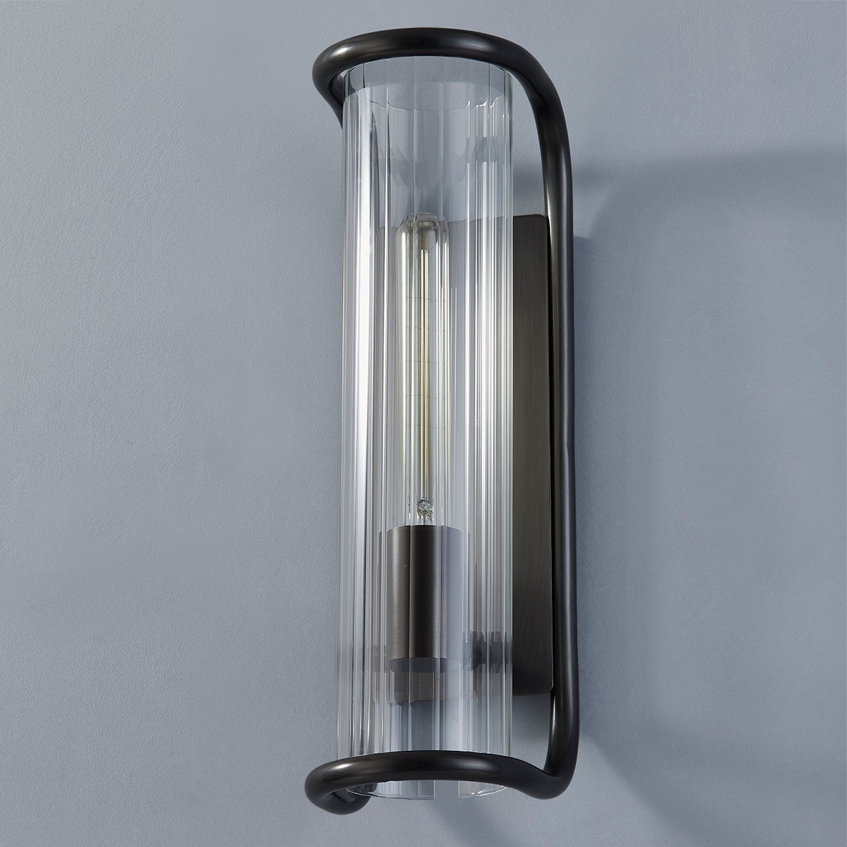 Fillmore Wall Sconce 5.5" x 16.75" in bronze shown from a second angle to highlight the arm curve and shade silhouette.