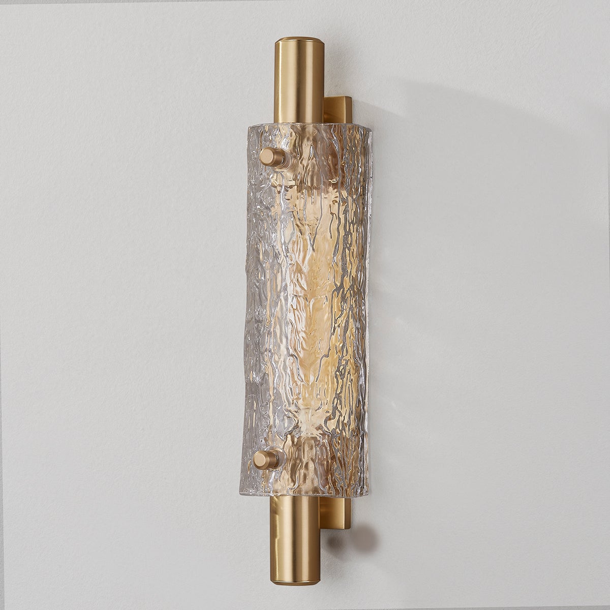 Harwich Wall Sconce 3.5" x 18" in aged brass shown from the front to reveal the arm curve and shade silhouette.