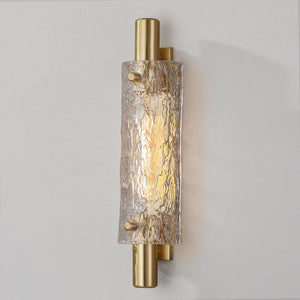 Close-up of the Harwich Wall Sconce 3.5" x 18" in aged brass showing the arm curve and shade silhouette.