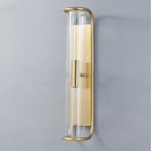 Fillmore Wall Sconce 5.5" x 26.25" in aged brass shown from a second angle to highlight the arm curve and shade silhouette.