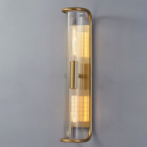 Fillmore Wall Sconce 5.5" x 26.25" in aged brass shown from the front to reveal the arm curve and shade silhouette.