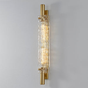 Close-up of the Harwich Wall Sconce 3.5" x 28.75" in aged brass showing the arm curve and shade silhouette.