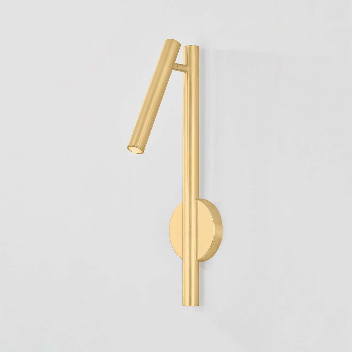 Close-up of the Circleville Wall Sconce in aged brass showing the arm curve and shade silhouette.