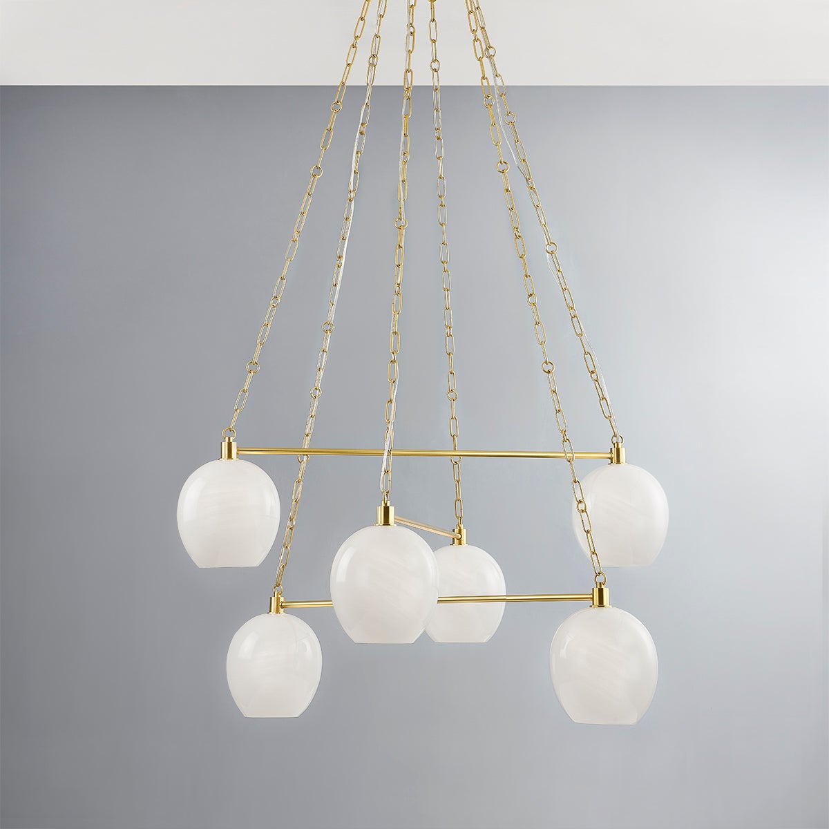 Asbury Park Chandelier 38" in aged brass shown from the front to reveal the frame, arms, and shade detail.
