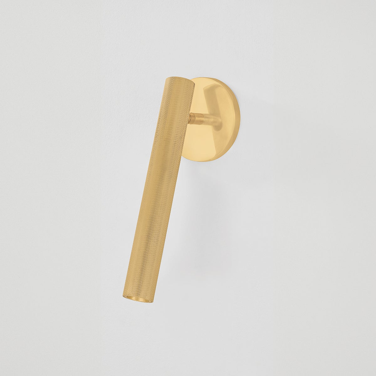 Simeon Wall Sconce in aged brass shown from the front to reveal the arm curve and shade silhouette.