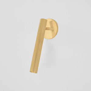 Simeon Wall Sconce in aged brass shown from the front to reveal the arm curve and shade silhouette.