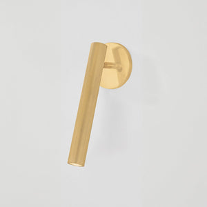 Close-up of the Simeon Wall Sconce in aged brass showing the arm curve and shade silhouette.