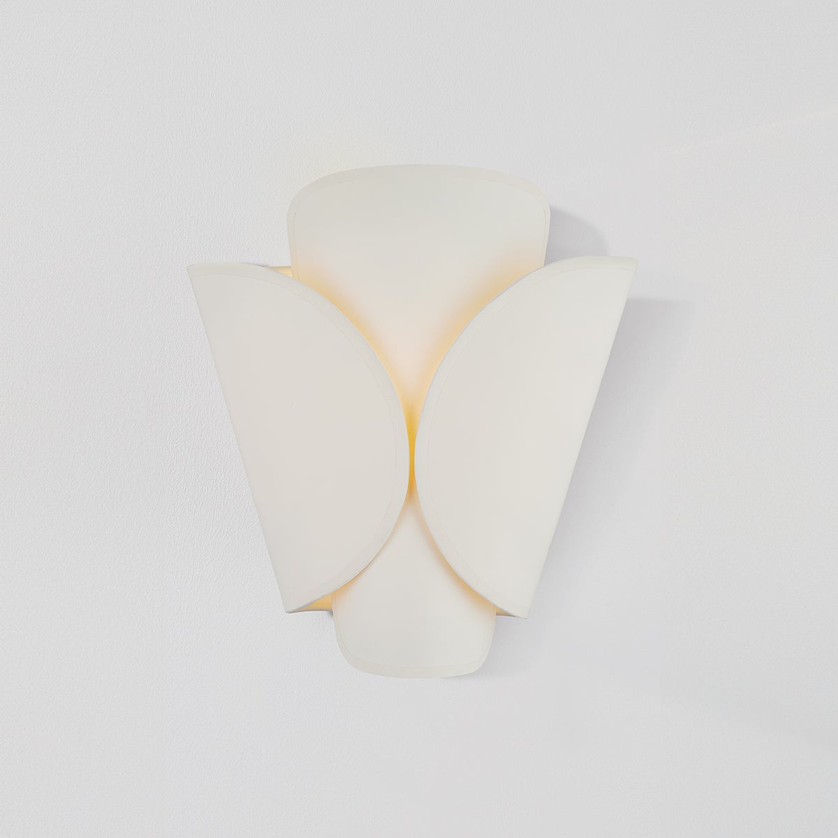 Close-up of the Savoie Wall Sconce in aged brass showing the arm curve and shade silhouette.