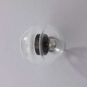 Close-up of the Kert Wall Sconce showing the arm curve and shade silhouette.