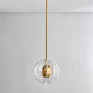 Kert Pendant 11.75" in aged brass shown from the front to reveal the shade shape and metal detail.