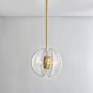 Close-up of the Kert Pendant 17" in aged brass showing the shade shape and metal detail.