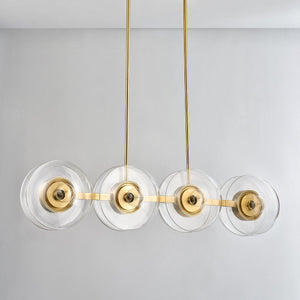 Kert Linear in aged brass shown from the front to reveal the extended frame and shade array.