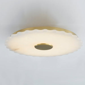 Highland Falls Flush Mount in aged brass shown from the front to reveal the shade profile and mounting canopy.