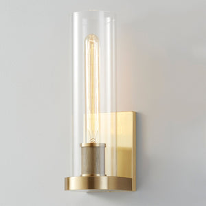 Close-up of the Porter Wall Sconce in aged brass showing the arm curve and shade silhouette.