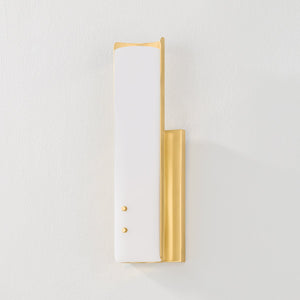 Lucio Wall Sconce 4.25" x 14.5" in aged brass shown from the front to reveal the arm curve and shade silhouette.