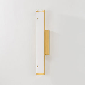 Lucio Wall Sconce 4.25" x 22.5" in aged brass shown from the front to reveal the arm curve and shade silhouette.