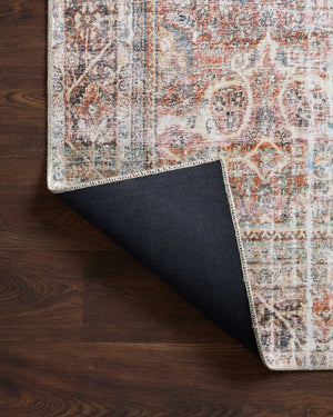Adrian Sunset / Charcoal styled underfoot in a layered living room at Laurie Yapp Home.