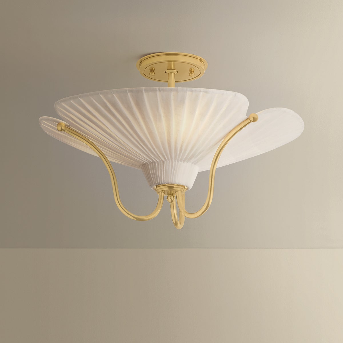 Gerhard Semi Flush in aged brass shown from the front to reveal the shade profile and mounting canopy.