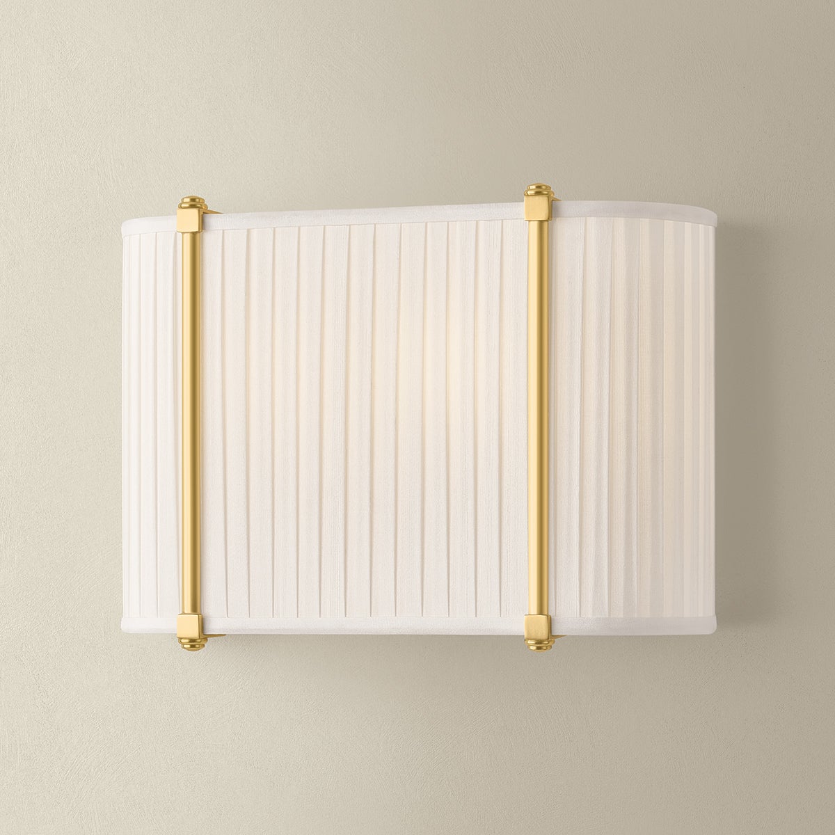 Cornell Wall Sconce 12" in aged brass shown from the front to reveal the arm curve and shade silhouette.