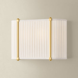 Cornell Wall Sconce 12" in aged brass shown from the front to reveal the arm curve and shade silhouette.