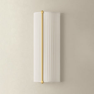 Cornell Wall Sconce 6.5" in aged brass shown from a second angle to highlight the arm curve and shade silhouette.