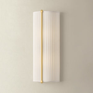 Cornell Wall Sconce 6.5" in aged brass shown from the front to reveal the arm curve and shade silhouette.
