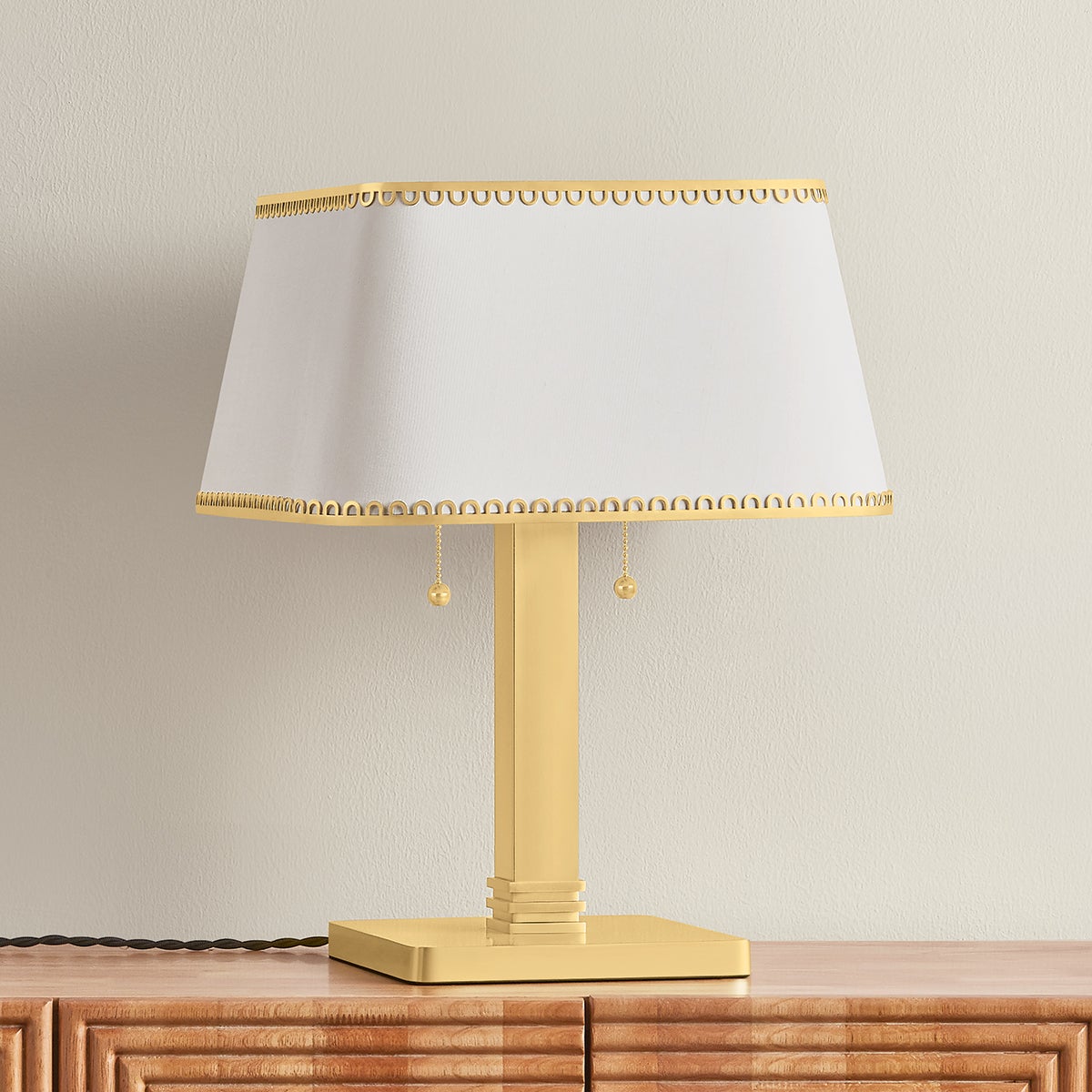 Claude Table Lamp in aged brass shown from a second angle to highlight the base and shade proportions.