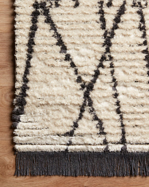 Alice Cream / Charcoal by Chris Loves Julia x Loloi (Pattern 1) shown in a curated living room setting at Laurie Yapp Home.