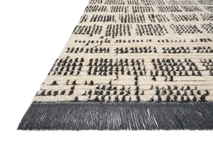 Side view of the Alice Cream / Charcoal by Chris Loves Julia x Loloi (Pattern 2) rug.