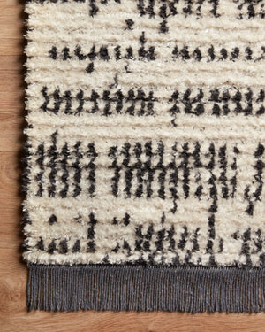 Alice Cream / Charcoal by Chris Loves Julia x Loloi (Pattern 2) shown in a curated living room setting at Laurie Yapp Home.