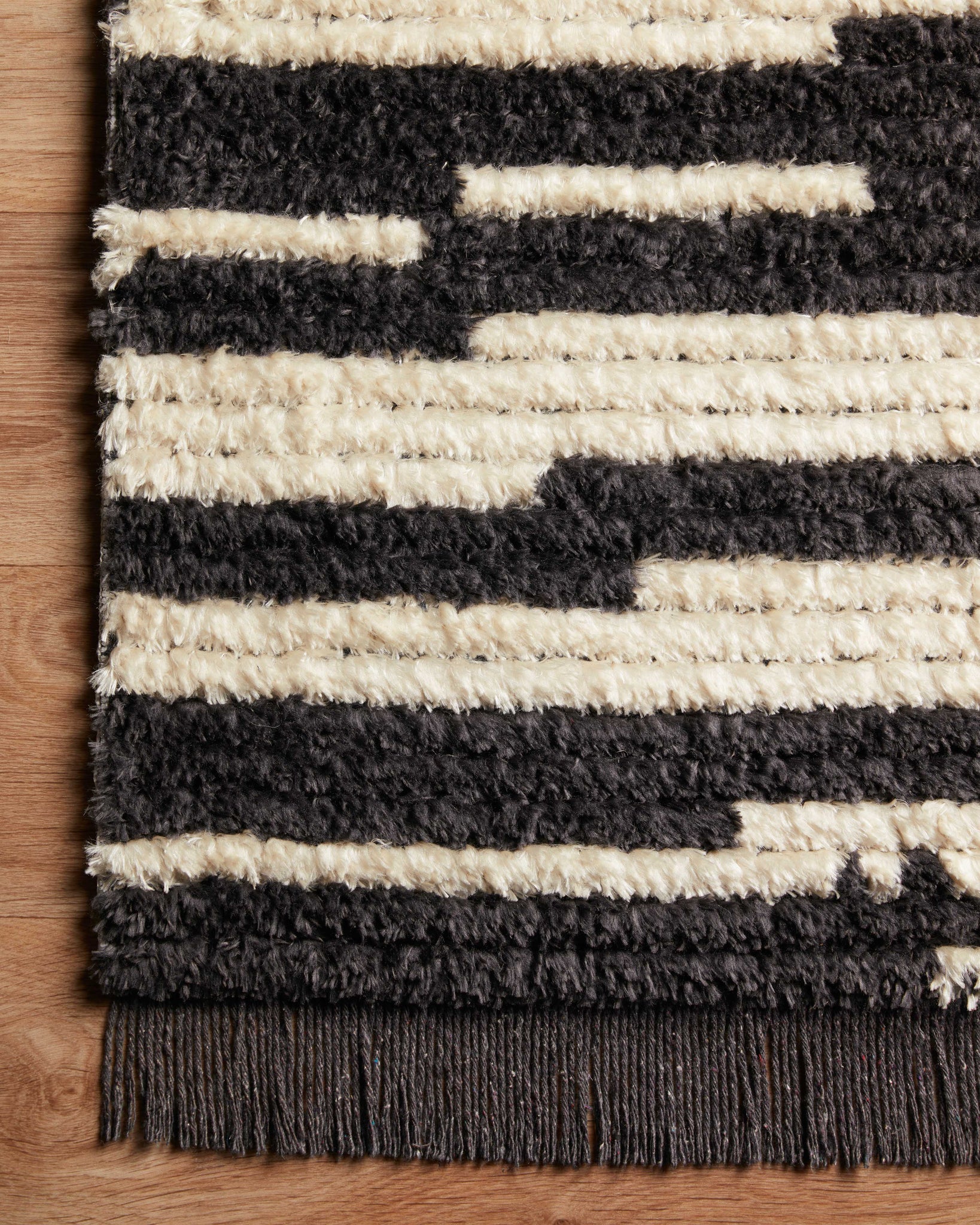 Alice Cream / Charcoal by Chris Loves Julia x Loloi (Pattern 3) styled in a living room at Laurie Yapp Home.