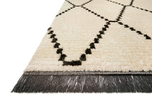 Side view of the Alice Cream / Charcoal by Chris Loves Julia x Loloi (Pattern 4) rug.